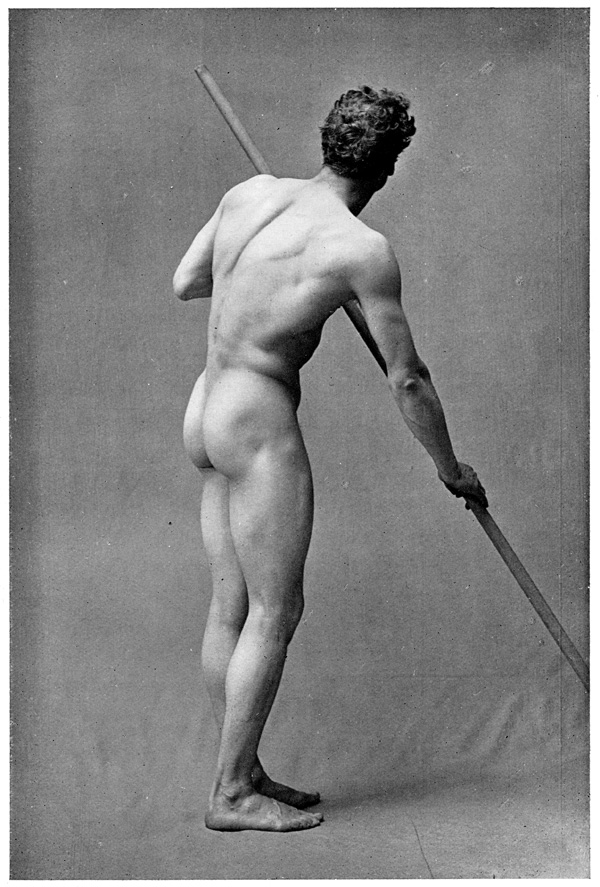 Male Figure Photography - A Figure a Man Straining his Muscles as He Rests His Weight Upon a Pole