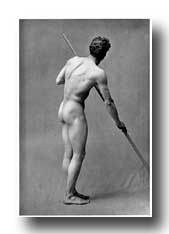 Male Figure Photography - Figure of a Man Straining His Muscles as He Rests His Weight Upon a Pole